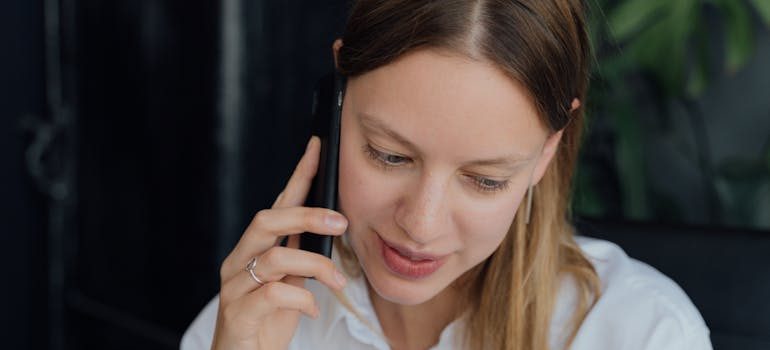 A smiling woman talking on the phone