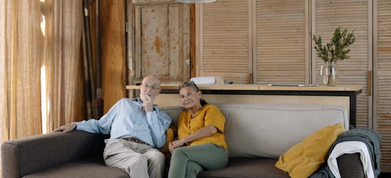 Senior sitting on a couch waiting for Bay Area senior movers
