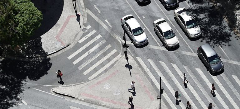 People and cars on a street