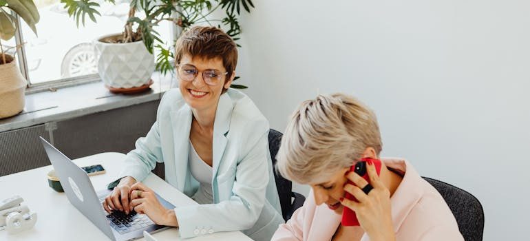 People in an office talking on the phone