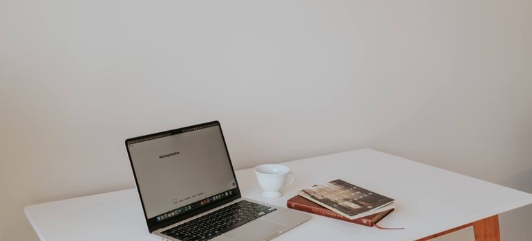 Books and a laptop on a table