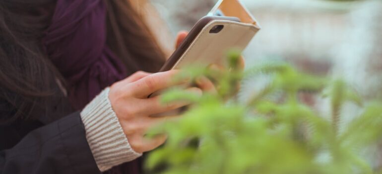 A woman holding a phone