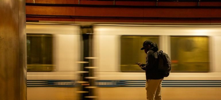 BART train arriving at a station platform serving the East Bay commute corridor