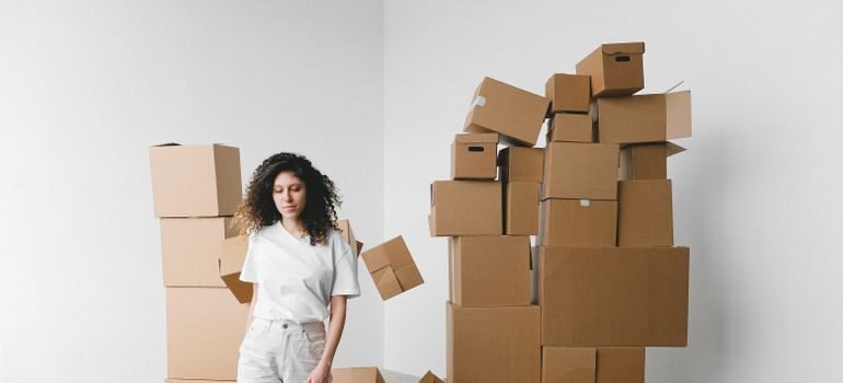 A person preparing boxes for a move