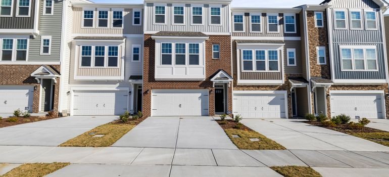 A row of three-story townhomes with garages, a common home type when moving to Dougherty Valley