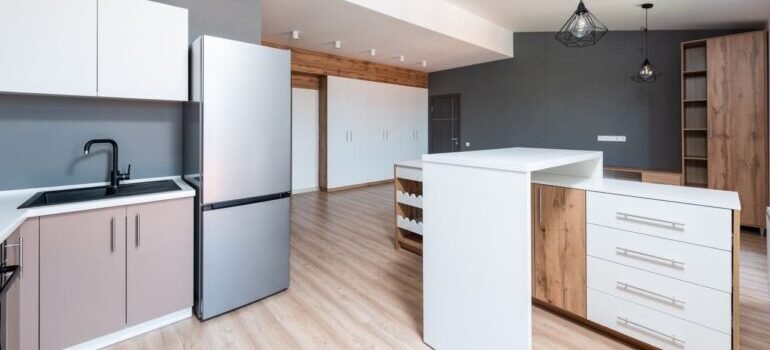 Spacious modern kitchen with minimalist design and elegant fixtures.